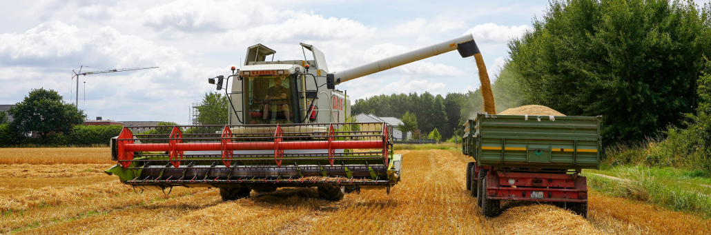 machine harvesting wheat from farm - agriculture internet - Fireline Broadband