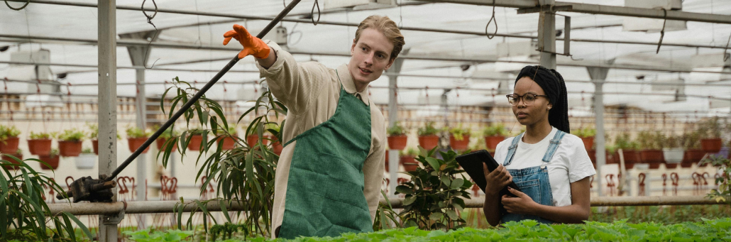 man pointing with lady holding tablet - agriculture internet - Fireline Broadband