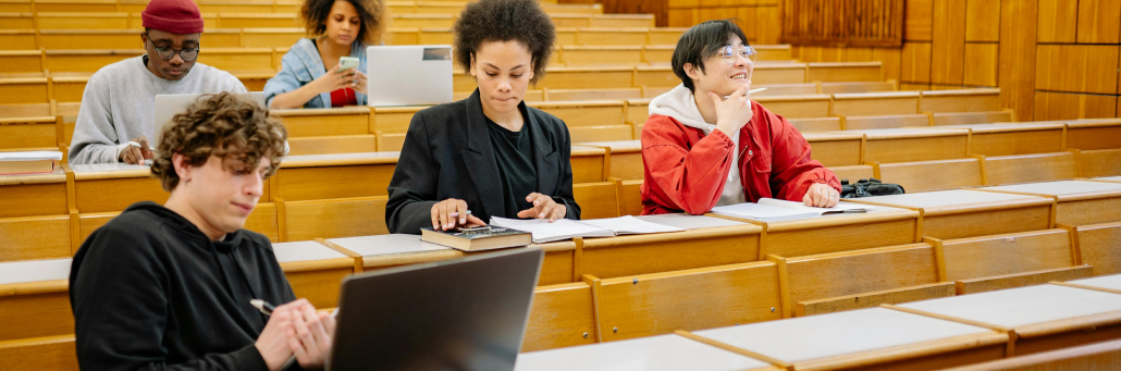 students in classroom learning and having laptop open - Fireline Broadband