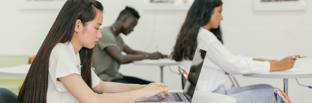students in classroom using laptops - Fireline Broadband