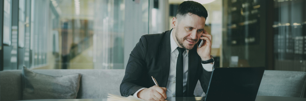 business man talking on the phone conversational ai by Fireline Broadband