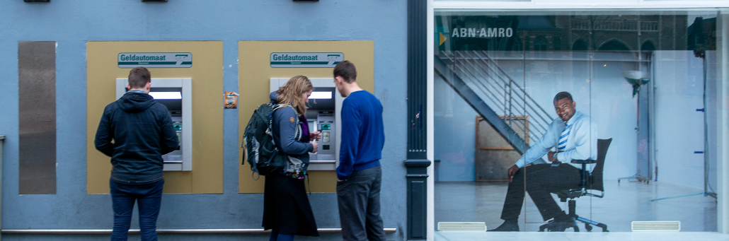 people at ATM - internet for finance - Fireline Broadband