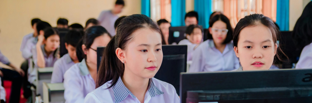 students in a computer lap working on school assignments - Fireline Broadband