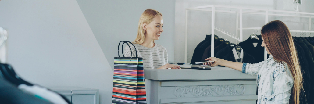 employee checking out customer at POS - by Fireline Broadband