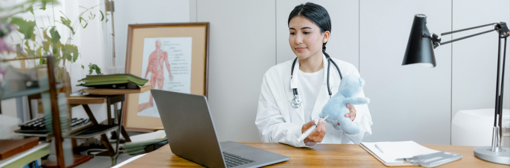 doctor demonstrating to patient pain points on bear via telehealth - telehealth internet - Fireline Broadband