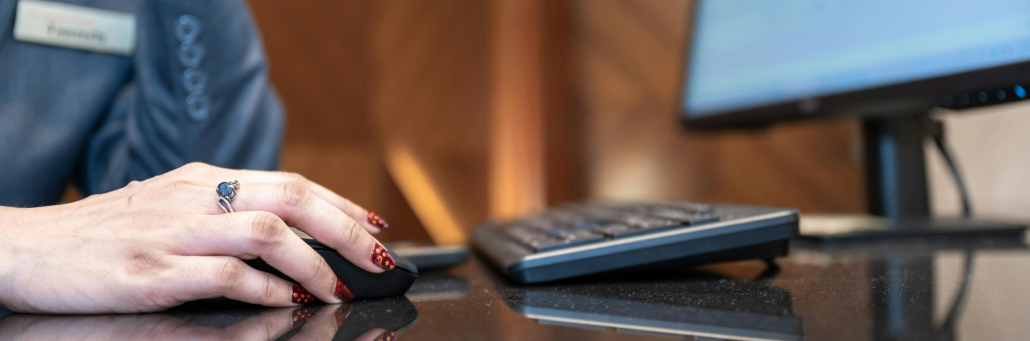 person using desktop to work - - SLA - Fireline Broadband