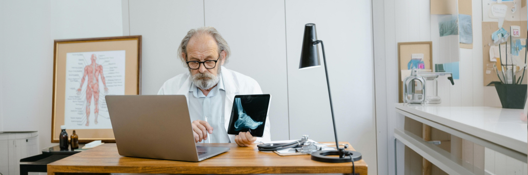 doctor checking emails on laptop - static ip address by Fireline Broadband