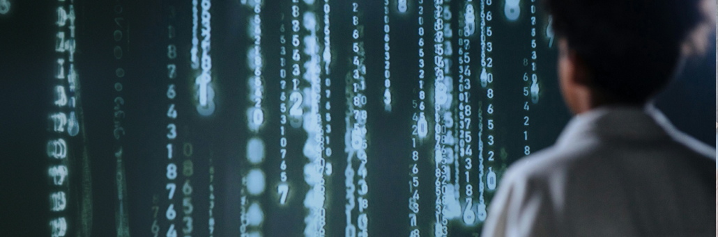 person staring at wall of binary code - Fireline Broadband