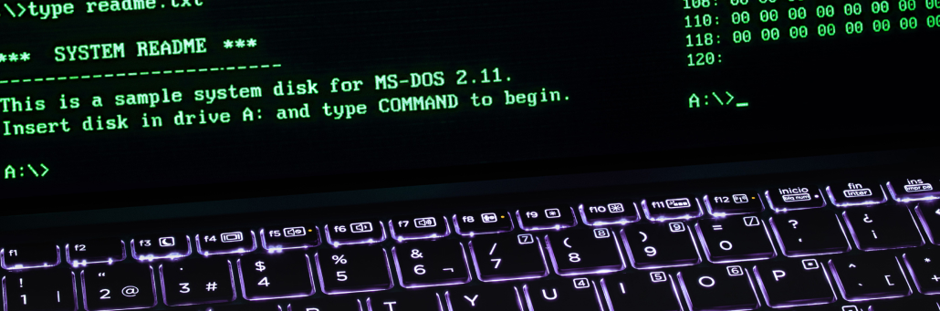 computer with lines of code - ddos - Fireline Broadband