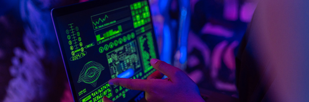 person typing code into computer - ddos - Fireline Broadband