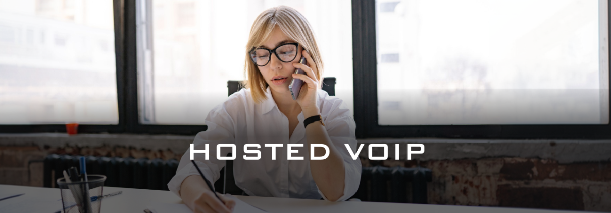 woman talking on the business phone - HOSTED voip - Fireline Broadband