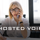 woman talking on the business phone - HOSTED voip - Fireline Broadband